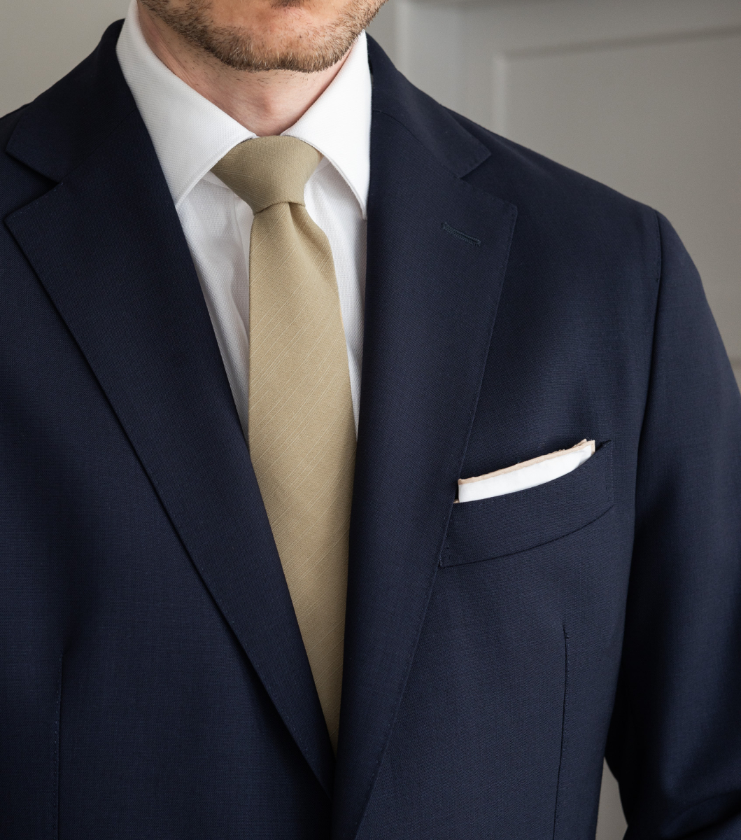 navy suit nude tie
