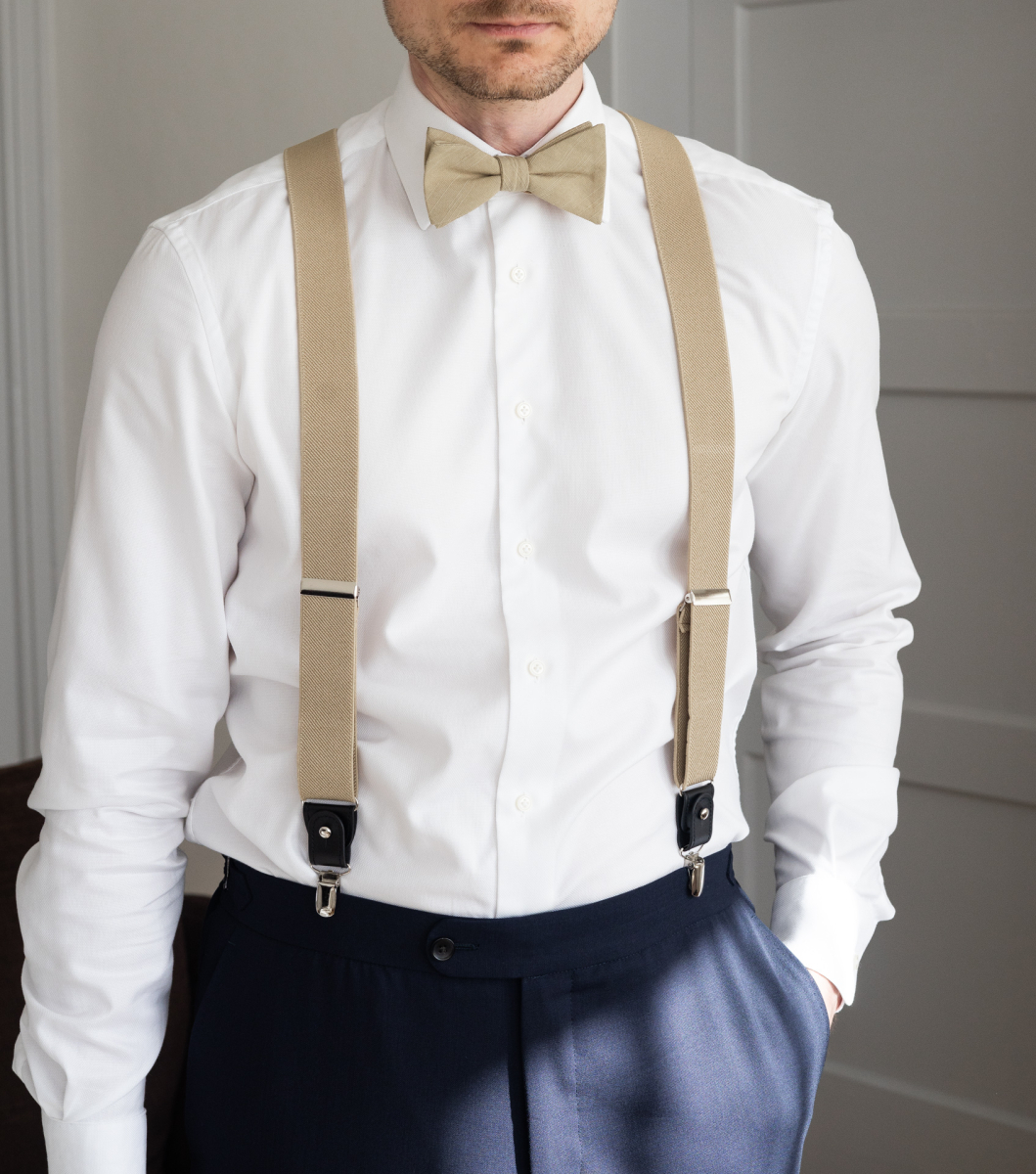 beige bow tie and suspenders