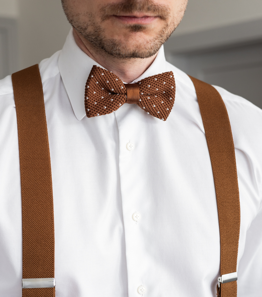 brown braces and bow tie